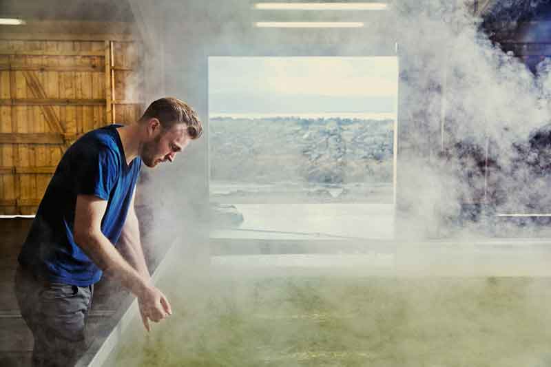 Gardar Stefansson, co-founder and CEO of Nordur, inspecting the salt-making process