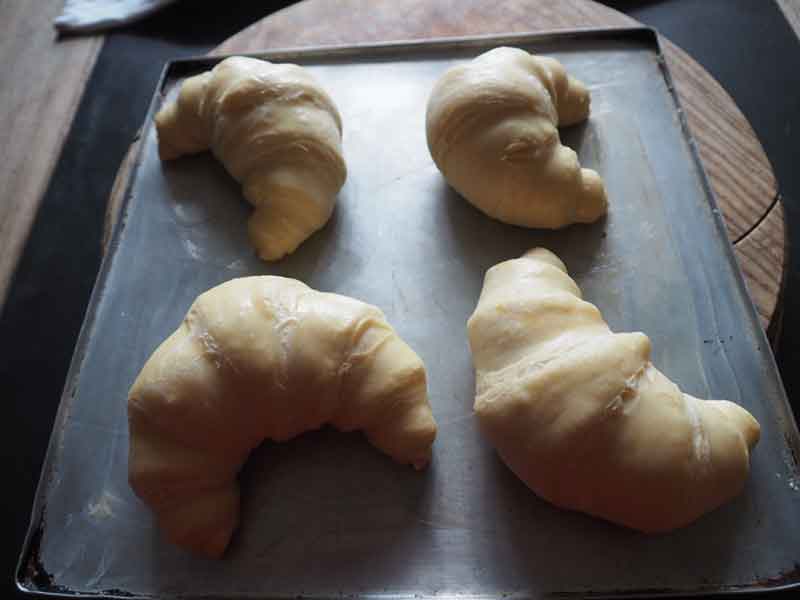 Defrosted croissants waiting to be baked