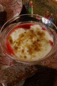 Cover the plums with yoghurt and sprinkle with soft brown sugar